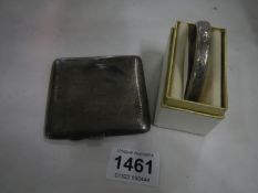 A Silver cigarette case and bangle