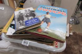 A box of football magazines and books