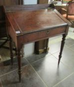 A Victorian sloping front teacher's desk on pine legs