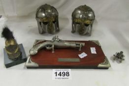 2 'Sutton  Hoe' miniature helmets, miniature cannon, miniature Napoleon pistol and Mini French