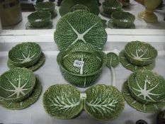 A majolica style cabbage leaf salad set with tureen