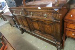 A carved oak sideboard