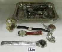 A silver plate tray of watches