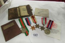 A quantity of WW2 medals, ration book etc