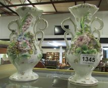 A pair of floral encrusted vases, both a/f