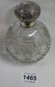 A silver topped cut glass perfume bottle, B'ham 1904/05