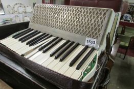 A Hohner 'Verdi' accordian in case
