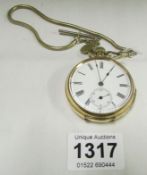 A gold plated pocket watch with chain