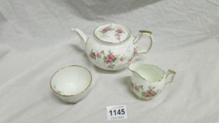 An Aynsley 'Grotto rose'  teapots, milk jug and sugar bowl