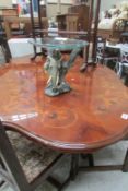 An Italian inlaid dining table