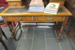 A 2 drawer leather topped writing desk