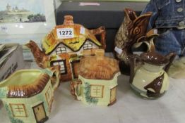 A cottage ware tea set, 'motto' pot and Devon 'gurgle' jug