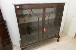 A Victorian astragal glazed display cabinet