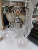 2 decanters, a claret jug, a wine jug and a glass dish