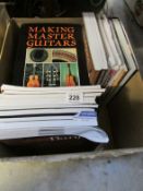 A box of guitar books