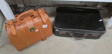 A Gladstone style bag and a small suitcase