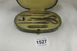 A cased Continental silver sewing set (thimble replaced)