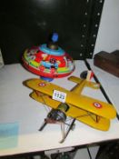 A Chad Valley spinning top and a tin toy plane