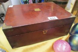 A mahogany writing box with brass corners