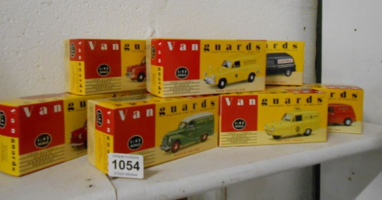 8 boxed Vanguards model vans