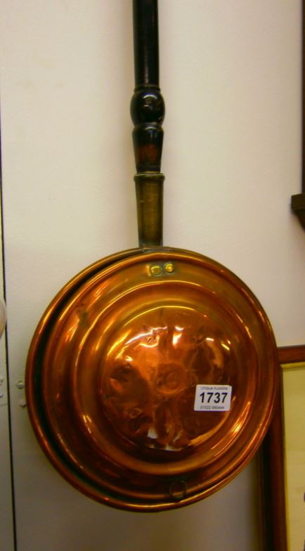 A copper warming pan