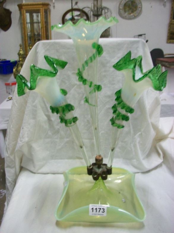 A green glass 3 trumpet epergne (parts do not match)