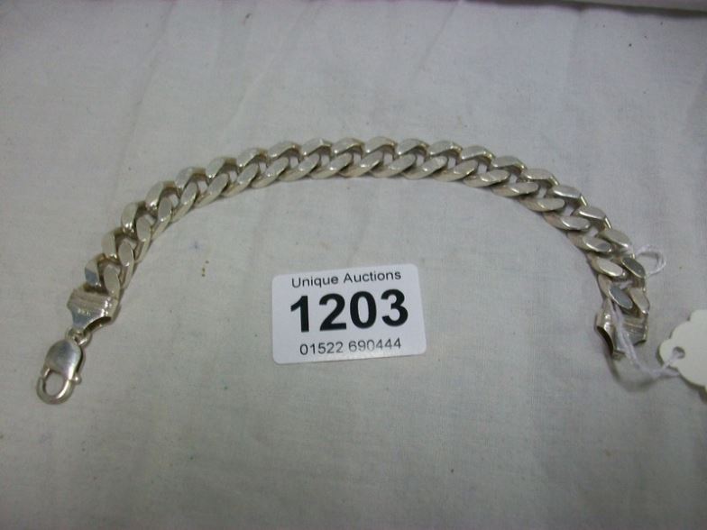 A heavy silver chain bracelet marked Italy 925, 63gms