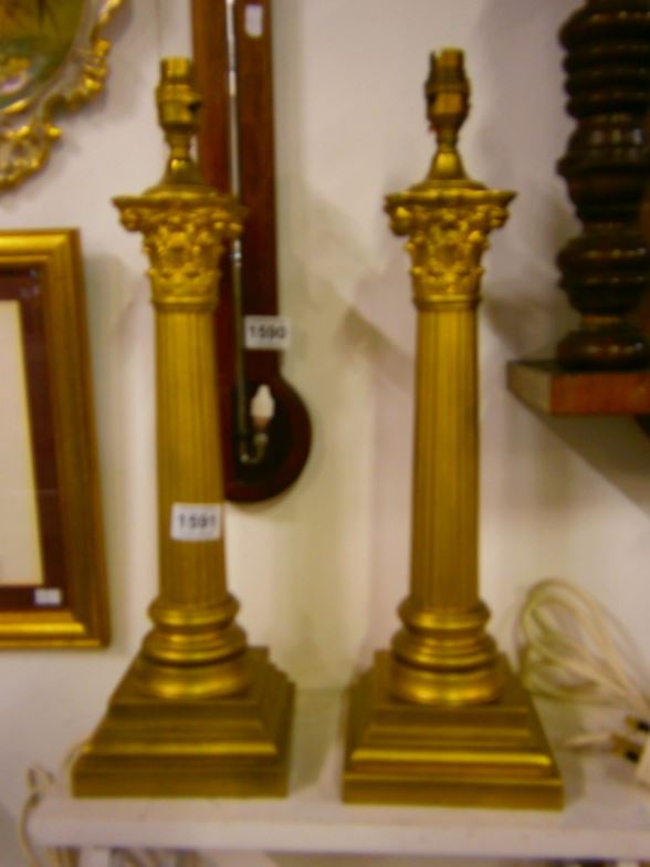 A pair of gilded metal Corinthian column table lamps