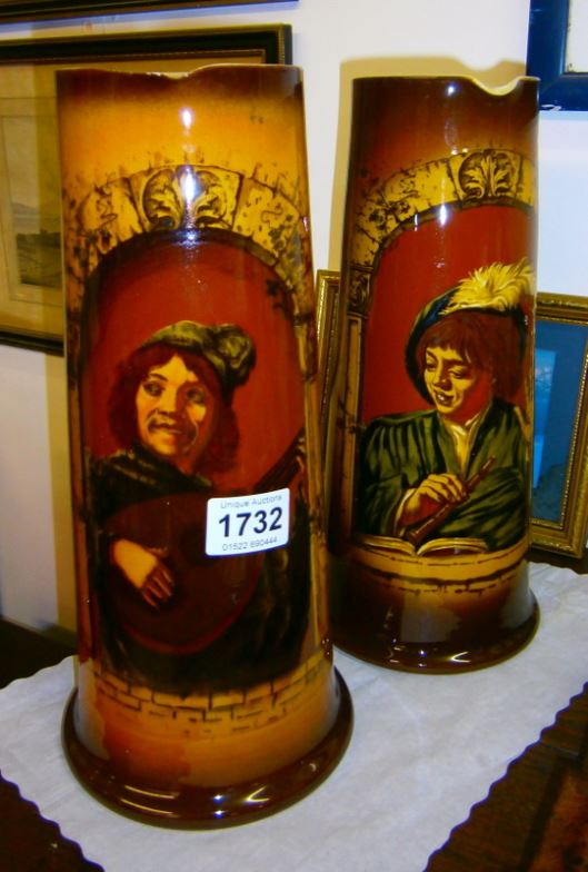 A pair of tall German beer jugs (1 a/f)