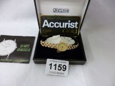A boxed 9ct gold Accurist wrist watch with certificate