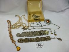 A mixed lot of jewellery in ivory effect box