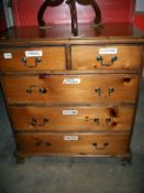 A pine 2 over 3 chest of drawers