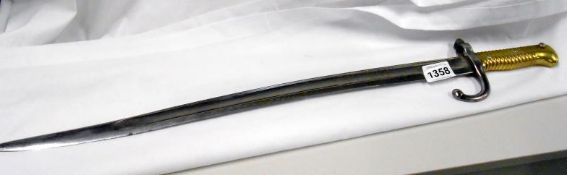 A brass handled bayonet