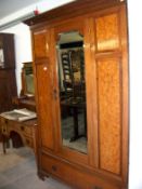 A birds eye maple wardrobe and dressing table