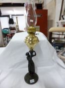 An ethnic figure oil lamp on marble base