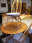 An Ercol dining table and 3 chairs