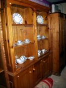 A pine 3 door open rack bookcase