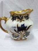 A large Doulton Burslem jug circa 1895, colourfully decorated with floral sprays & richly gilded