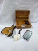 A cased Meerscham pipe, cigarette box and lighter