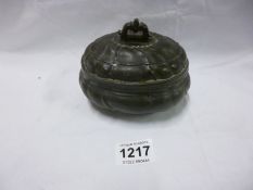 An antique pewter lidded pot