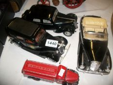A Schucco model fire truck and 3 other model cars