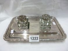 A Barker and Ellis silver plated inkstand (odd inkwells)