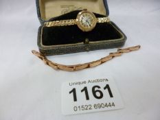 A 9ct gold ladies wristwatch on metal bracelet + original a/f gold bracelet