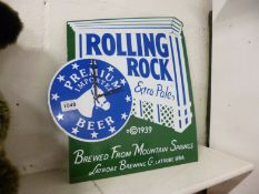 A 'Rolling Rock' enamel advertising sign