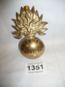 A brass badge 'Waterloo June 18th, 1815'
