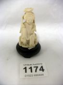 An miniature early 20th century ivory figure,