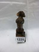 A bronze begging dachsund