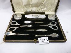 A cased silver manicure set