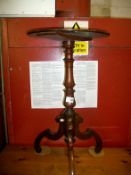 A mahogany tripod wine table