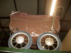 An early 20th century doll's pram